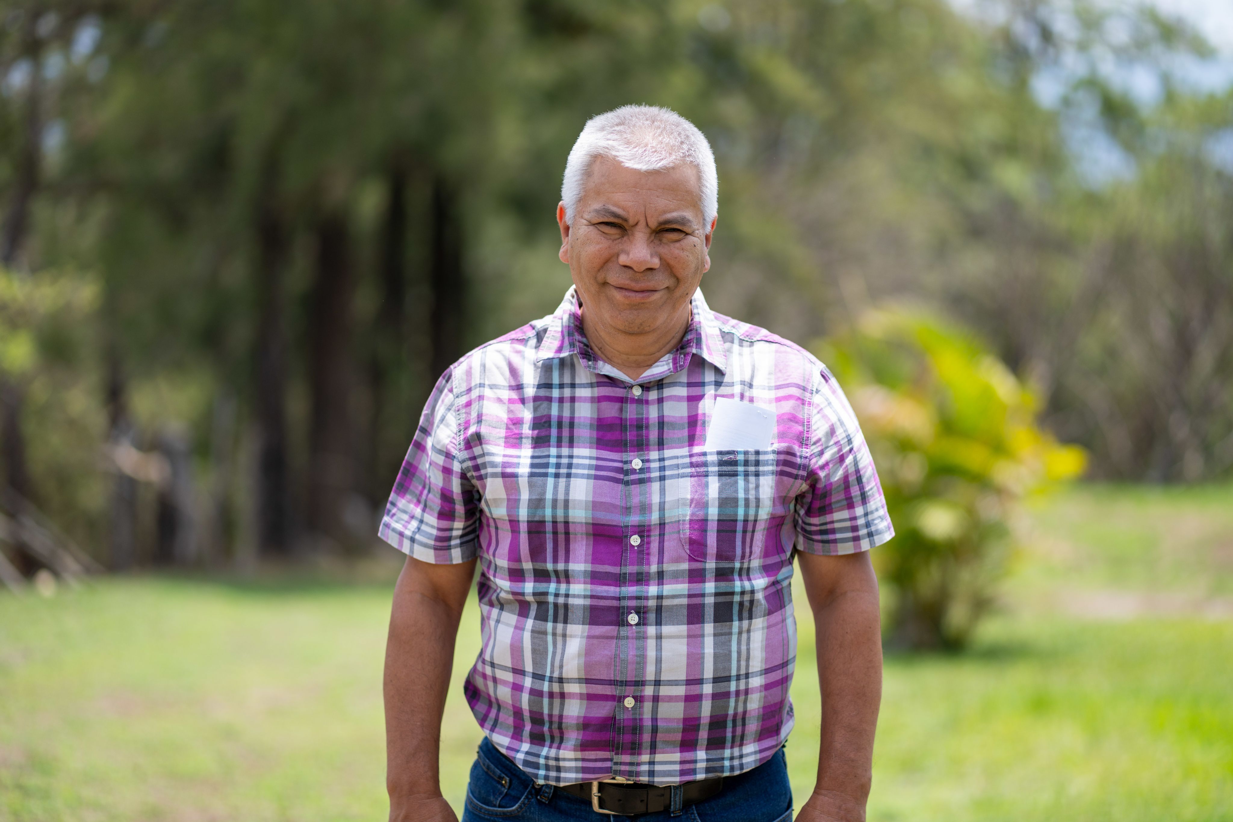 Man, upper body,  looking straight into camera.
